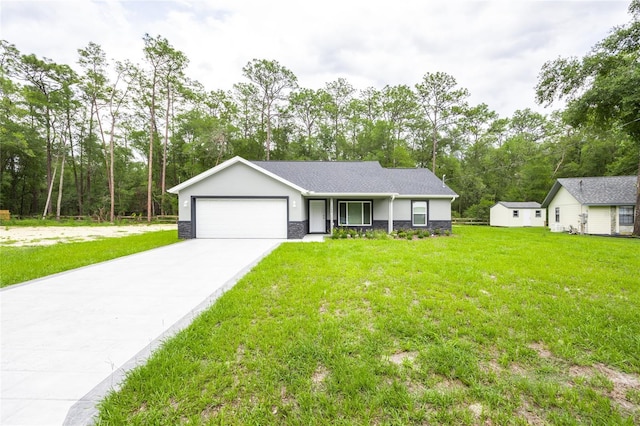 1243 NE 130th Ter, Silver Springs, FL 34488 - single story home with an attached garage, stone siding, concrete driveway, and a front yard