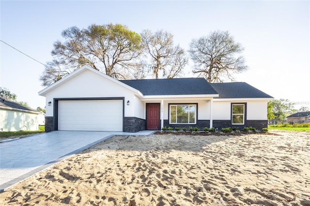 ranch-style home with an attached garage, concrete driveway, stone siding, roof with shingles, and stucco siding