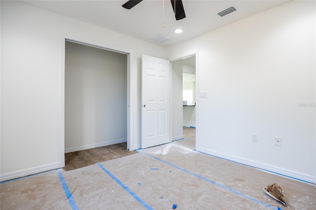 unfurnished bedroom featuring a ceiling fan, a closet, visible vents, and baseboards