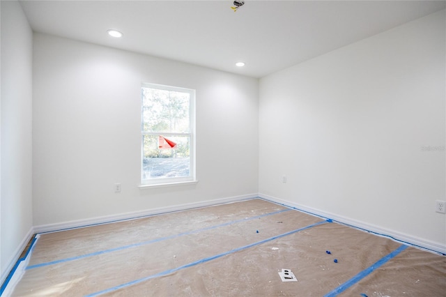 unfurnished room with recessed lighting