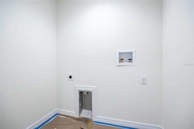 laundry area featuring hookup for a washing machine, electric dryer hookup, wood finished floors, laundry area, and baseboards