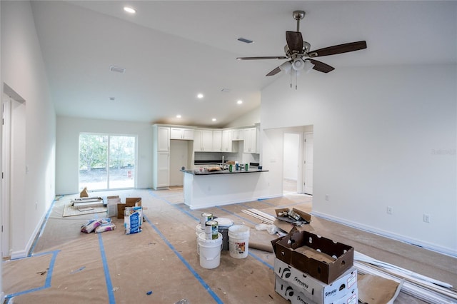 living area featuring recessed lighting, visible vents, ceiling fan, high vaulted ceiling, and baseboards