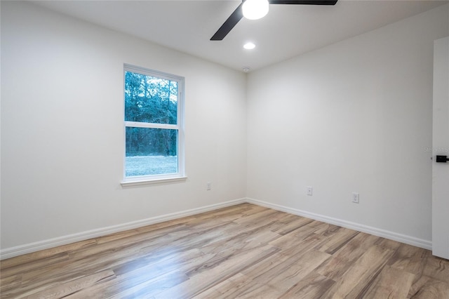 unfurnished room with ceiling fan and light hardwood / wood-style flooring