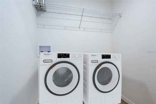 washroom with separate washer and dryer