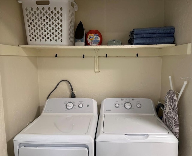 washroom featuring washer and clothes dryer