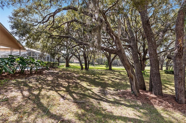 view of yard with a lanai