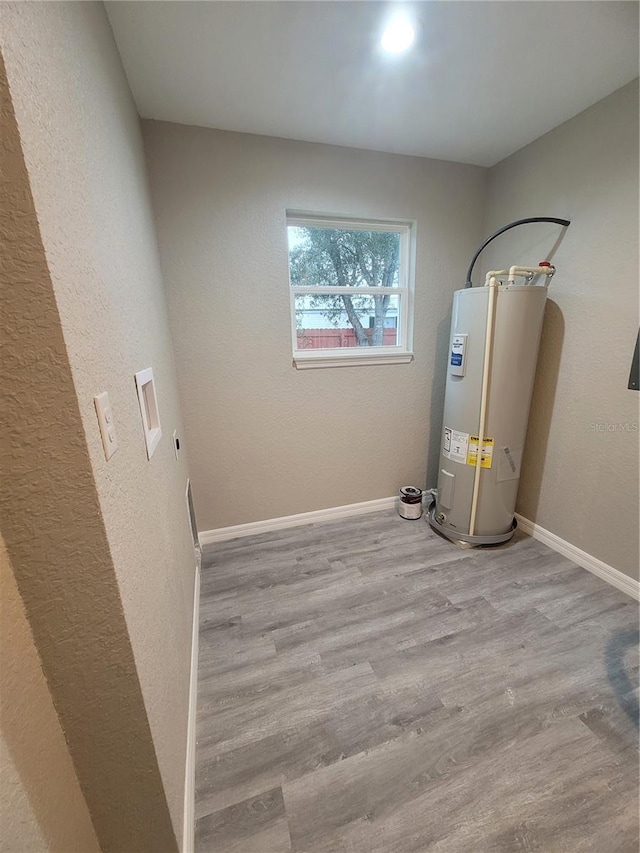 utility room with water heater