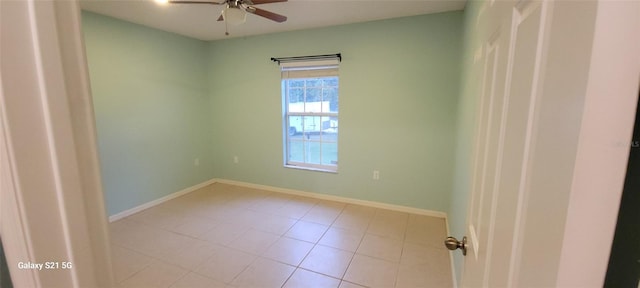 empty room featuring ceiling fan and light tile patterned flooring