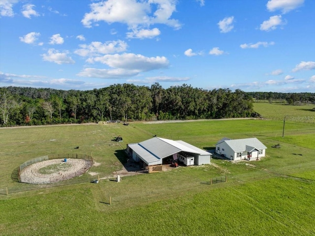 birds eye view of property with a rural view