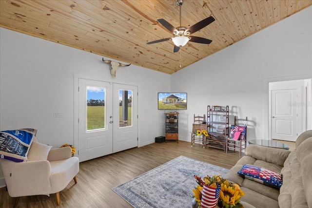 living room featuring french doors, wooden ceiling, ceiling fan, and light hardwood / wood-style flooring