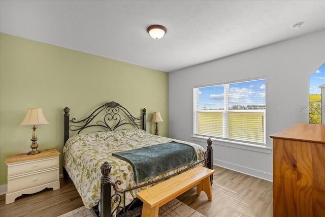 bedroom with hardwood / wood-style flooring