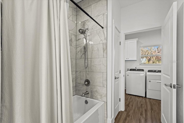 bathroom with shower / bath combo with shower curtain, wood-type flooring, and washer and dryer