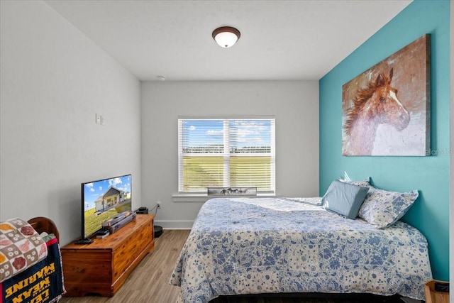 bedroom featuring wood-type flooring