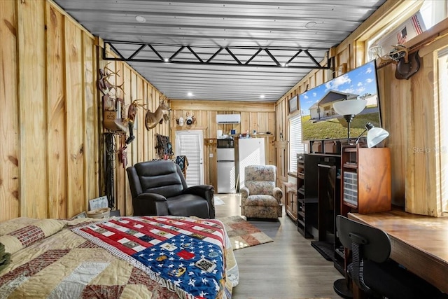 bedroom with wooden walls, wood-type flooring, and wooden ceiling