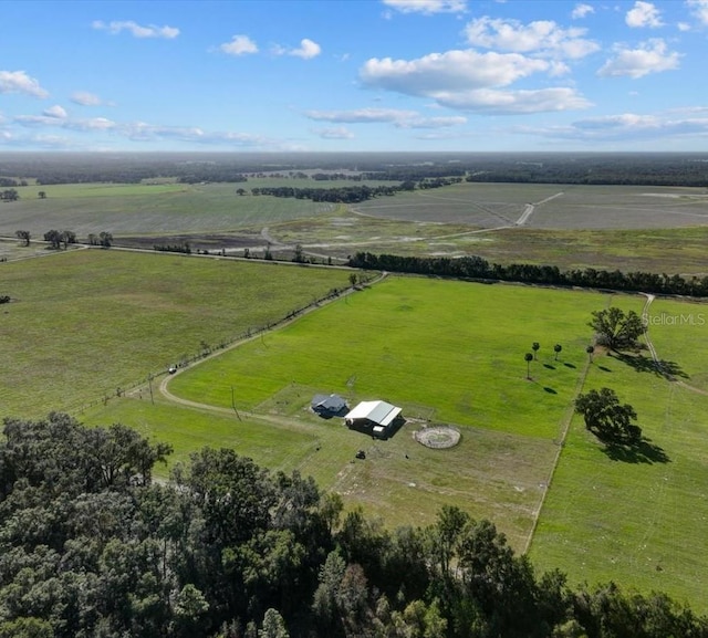 birds eye view of property featuring a rural view