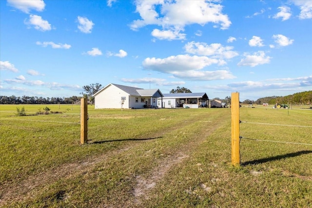 view of yard with a rural view