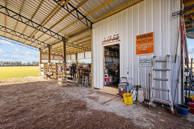 view of stable with a rural view