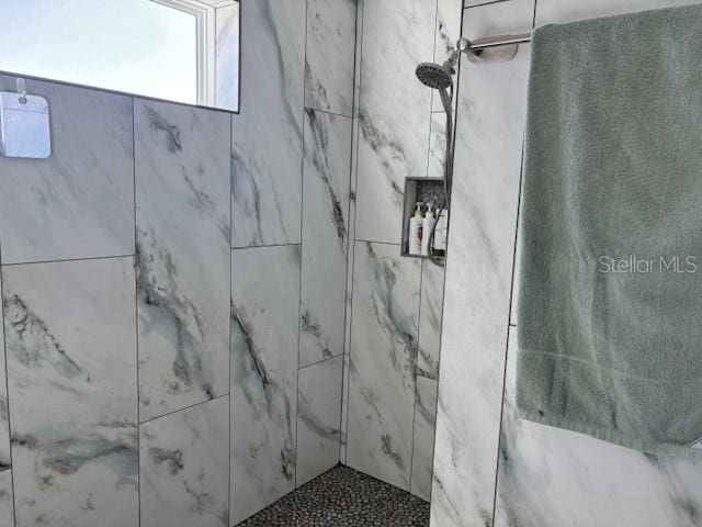 interior space with a tile shower