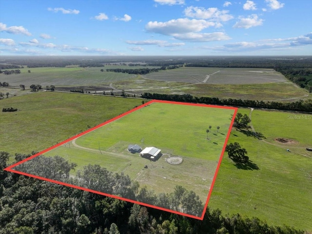 birds eye view of property featuring a rural view