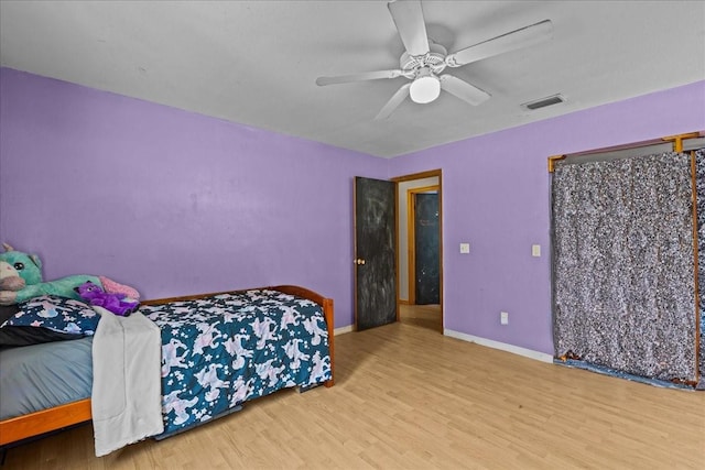 bedroom featuring wood-type flooring and ceiling fan