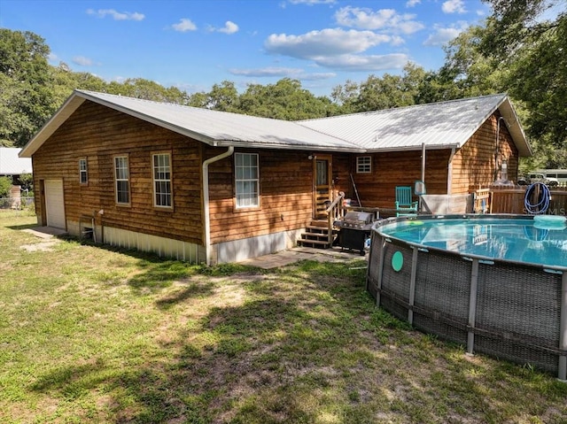 rear view of house with a yard