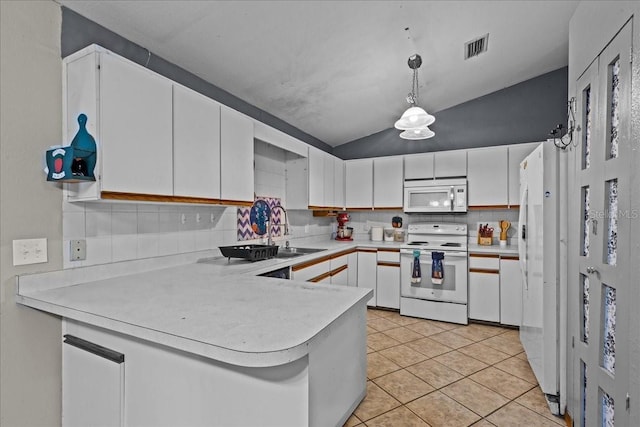 kitchen featuring white appliances, white cabinets, a peninsula, light countertops, and a sink