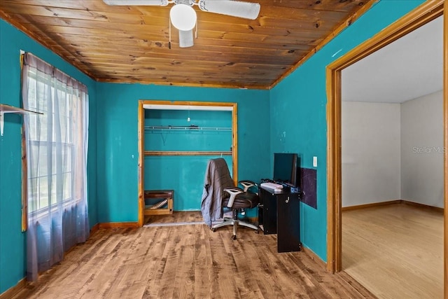 office area with wooden ceiling, a ceiling fan, baseboards, and wood finished floors