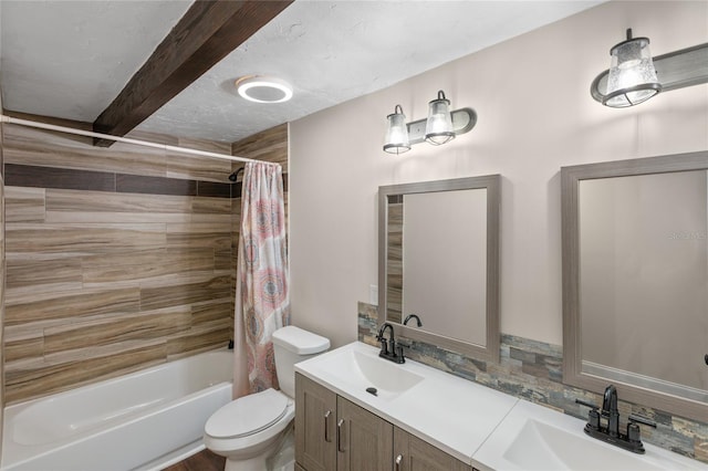 full bathroom with shower / bath combo with shower curtain, toilet, tasteful backsplash, and vanity