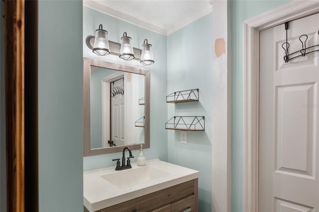 bathroom with vanity and crown molding