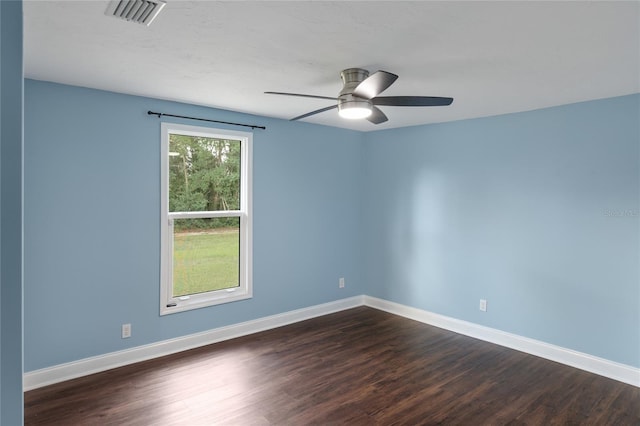 spare room featuring ceiling fan and dark hardwood / wood-style flooring