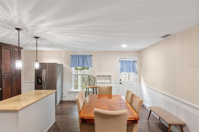 dining area with dark hardwood / wood-style flooring