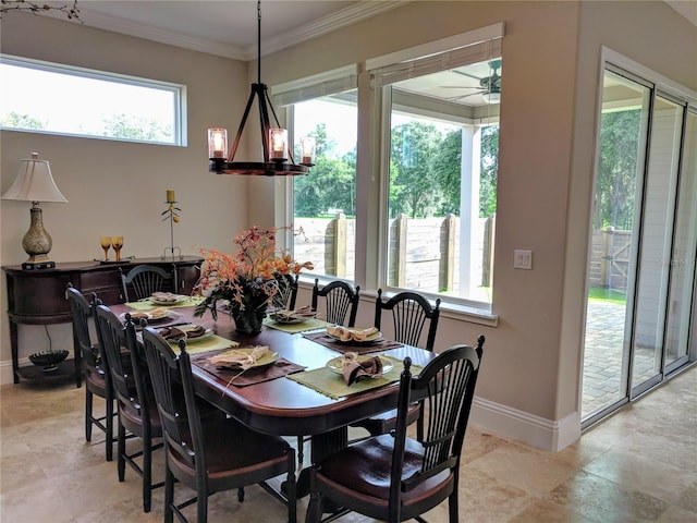 6475 SW 74th Dr, Gainesville, FL 32608 - dining area featuring baseboards, crown molding, and a ceiling fan