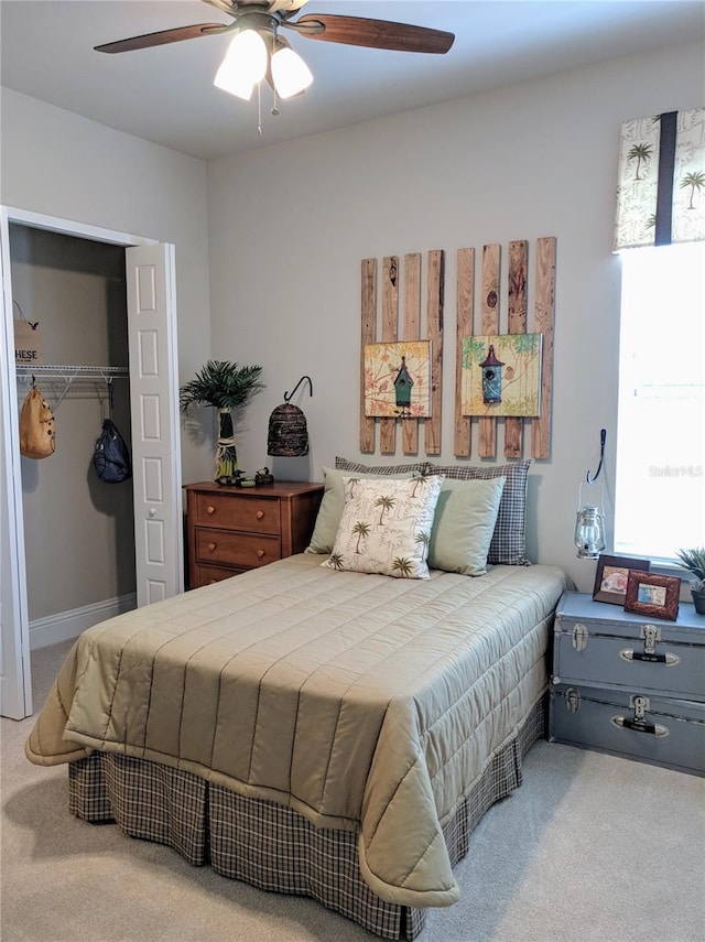 6475 SW 74th Dr, Gainesville, FL 32608 - carpeted bedroom featuring a closet, ceiling fan, and a walk in closet