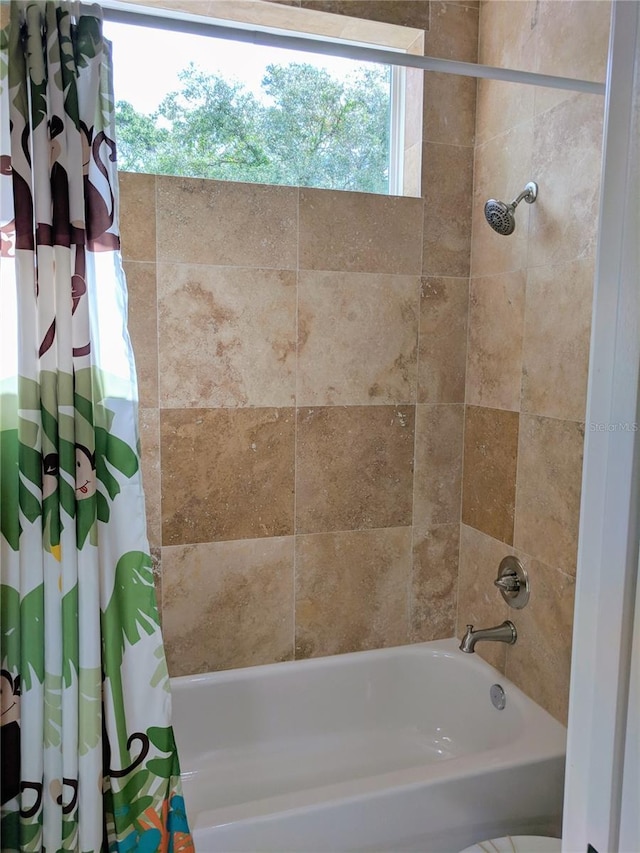 6475 SW 74th Dr, Gainesville, FL 32608 - bathroom with shower / bath combo with shower curtain
