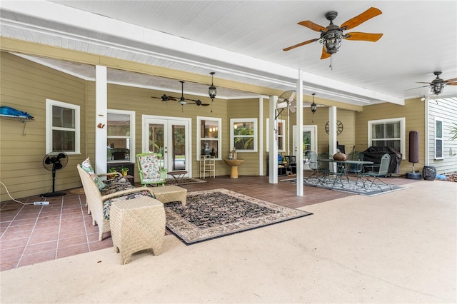 view of patio with french doors and ceiling fan