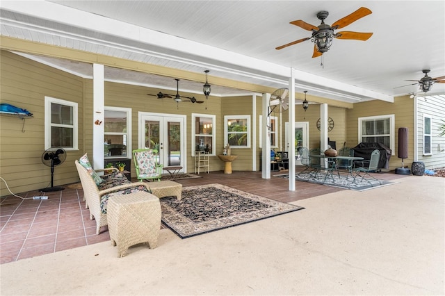 view of patio / terrace featuring ceiling fan and french doors