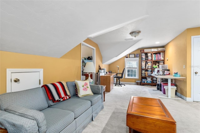 carpeted living area with lofted ceiling