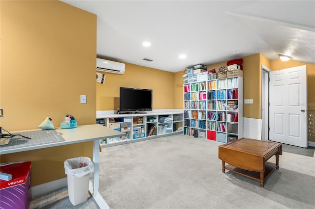 living area with an AC wall unit and carpet