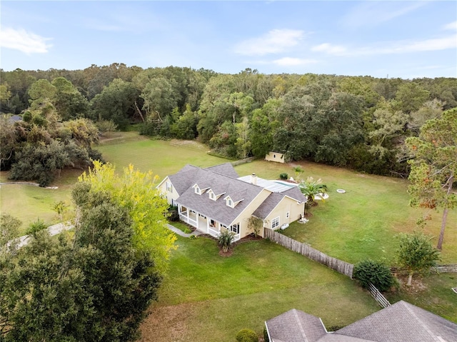 view from above of property with a forest