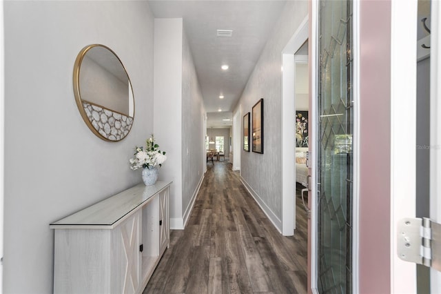 corridor featuring dark hardwood / wood-style flooring