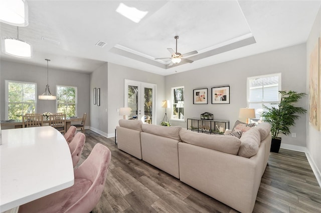 1035 NW 132nd Blvd, Newberry, FL 32669 - living room with baseboards, wood finished floors, ceiling fan, and a tray ceiling