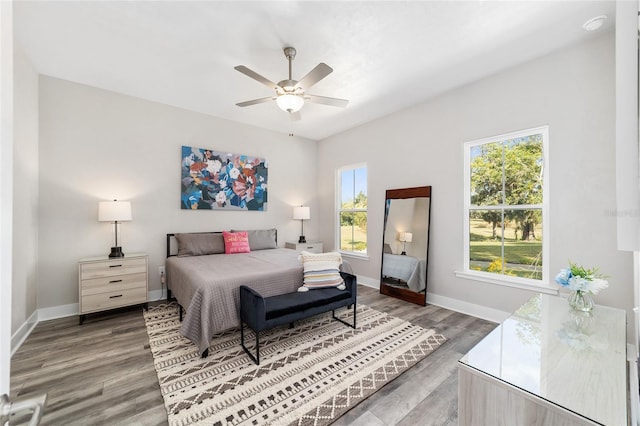 1035 NW 132nd Blvd, Newberry, FL 32669 - bedroom featuring wood finished floors, baseboards, and a ceiling fan
