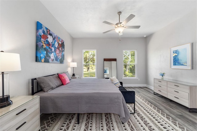 bedroom featuring ceiling fan and dark hardwood / wood-style floors