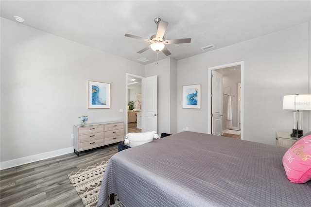 bedroom featuring dark hardwood / wood-style flooring, connected bathroom, and ceiling fan