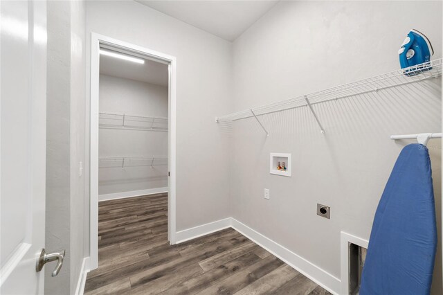 laundry room with dark hardwood / wood-style flooring, washer hookup, and hookup for an electric dryer