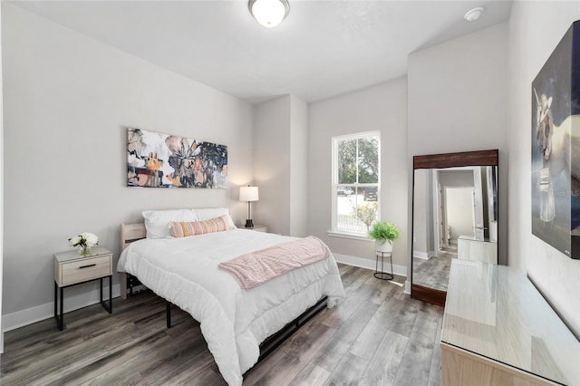 bedroom with hardwood / wood-style flooring