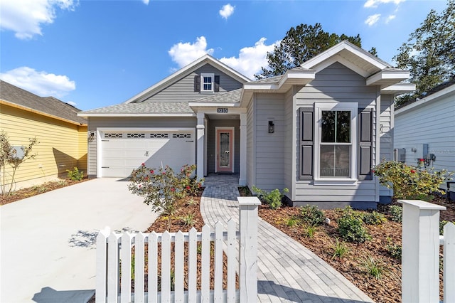 view of front of property with a garage