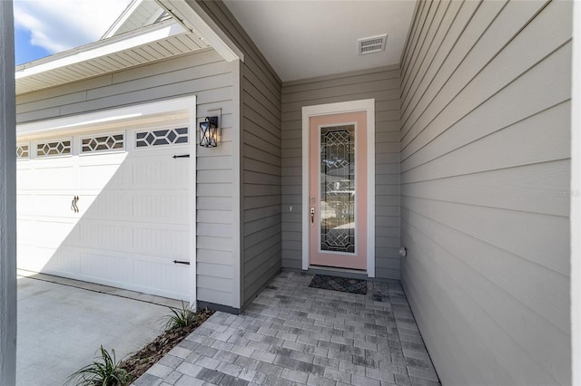 1035 NW 132nd Blvd, Newberry, FL 32669 - view of exterior entry with a garage