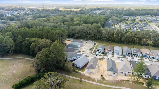 1035 NW 132nd Blvd, Newberry, FL 32669 - aerial view of property's location with nearby suburban area and a heavily wooded area