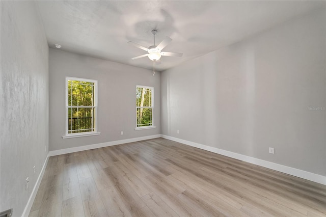 unfurnished room featuring light wood-type flooring and ceiling fan